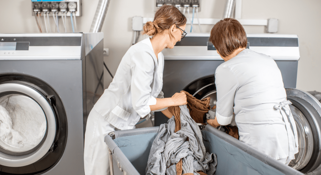 Inserting clothes on laundry machine