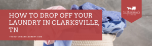 A woven laundry basket filled with clothes sits in front of a gray background. A red banner reads, "How to drop off your laundry in Clarksville, TN. thedutchmanslaundry.com.
