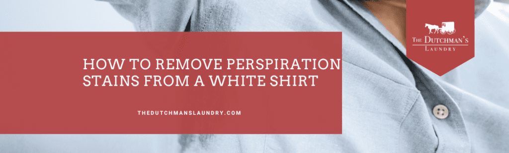 Close-up of a person in a light blue shirt with text overlay: "How to remove perspiration stains from a white shirt." Logo for The Dutchman's Laundry is in the top right corner.