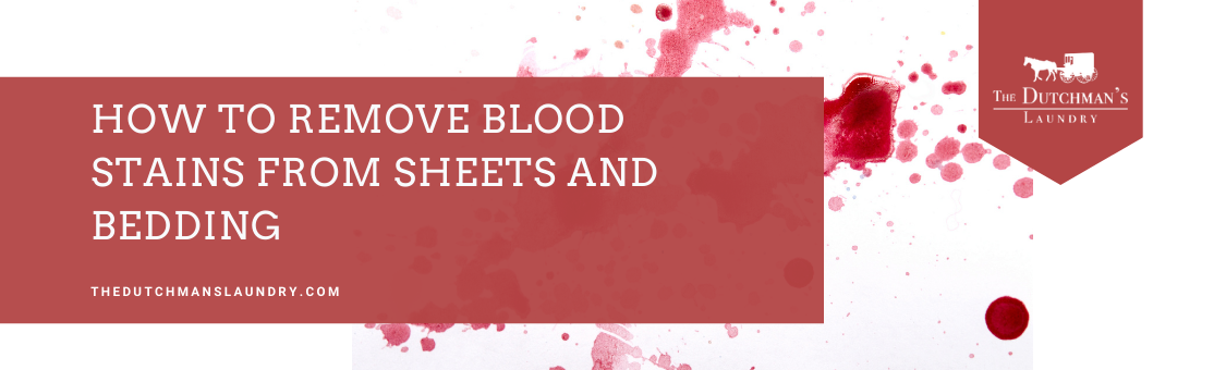 Red blood stains on white fabric with a text overlay reading "How to Remove Blood Stains from Sheets and Bedding - The Dutchman's Laundry.