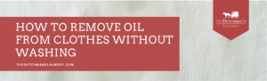 Red banner with white text: "How to remove oil from clothes without washing." Logo of The Dutchman's Laundry in the top right corner. Faint fabric background.